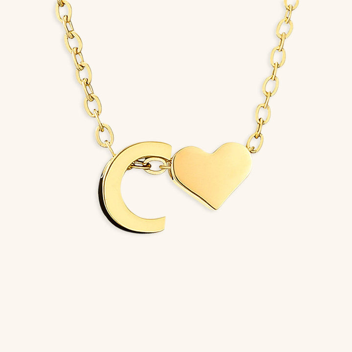 navnesmykke med initialen Ria | 18k Guld