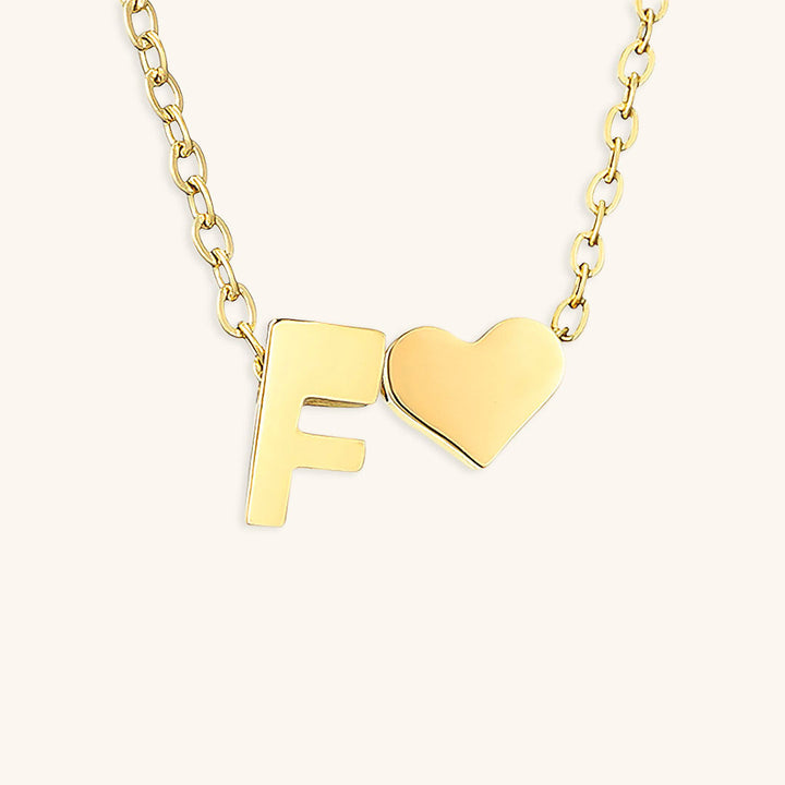 navnesmykke med initialen Ria | 18k Guld