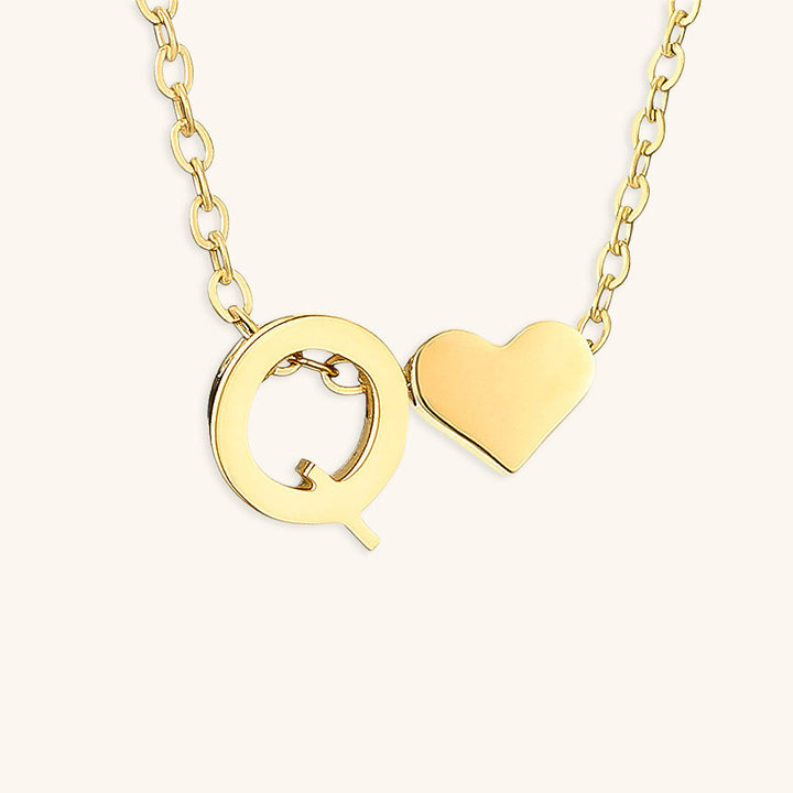 navnesmykke med initialen Ria | 18k Guld