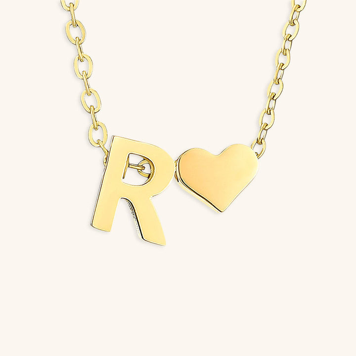 navnesmykke med initialen Ria | 18k Guld