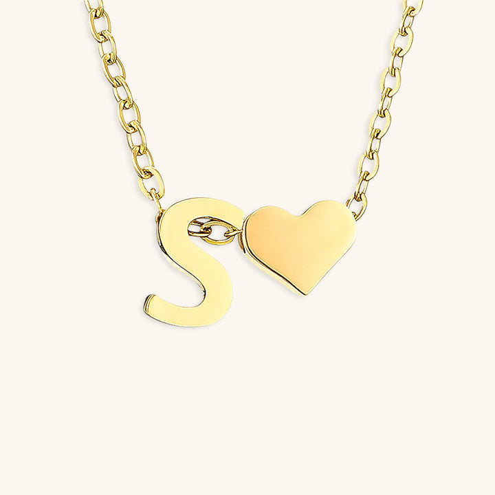 navnesmykke med initialen Ria | 18k Guld