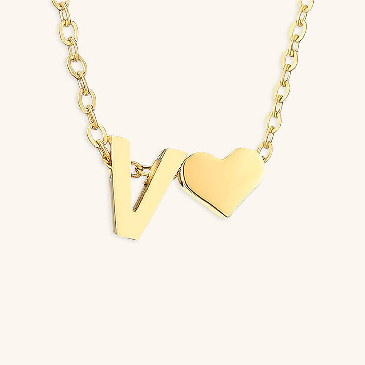 navnesmykke med initialen Ria | 18k Guld